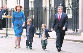 British Prime Minister Gordon Brown along with his wife Sarah and kids John and Fraser walks past 10 Downing Street in London after announcing his resignation