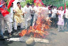 SP workers burn an effigy of Nitin Gadkari in protest against his derogatory remarks against Mulayam Singh Yadav in Lucknow on Thursday.