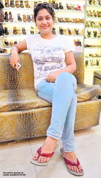 The model is wearing red sandals available for Rs 550