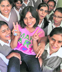 Saloni Singh (C) of DAV Public School, Panchkula, topped in arts stream of CBSE Class XII on Wednesday.