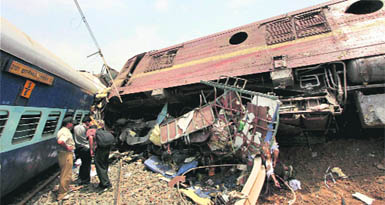 Security personnel and volunteers look for survivors at the site where the Gyaneswari Expressderailed and collided with a goods train following an explosion on the track at Saridah in West Midnapore district of West Bengal on Friday.