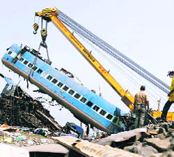 Crane carries out rescue work at the accident site at Saridha in West Midnapore district on Saturday.