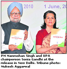 PM Manmohan Singh and UPA chairperson Sonia Gandhi at the release in New Delhi. Tribune photo: Mukesh Aggarwal