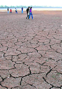 With the Sukhna lake water receding, residents now even walk and play football on its drying bed.