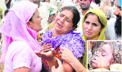 Grieving mother of Dilnaz (inset), who died after falling into a borewell, in Dheera village of Gurdaspur on Thursday.