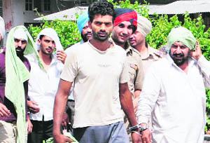 The smugglers, who were arrested by the Punjab Police, being taken to the Civil Hospital in Amritsar on Wednesday.