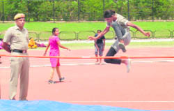 A girl candidate attempts a high jump during the physical test for the post of constable at Tau Devi Lal Stadium, Sector 3, Panchkula, on Tuesday.