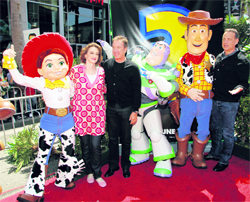 Actress Joan Cusack (2nd L), who plays the voice of the character Jessie (L), actor Tim Allen (3rd L), who plays the voice of the character Buzz Lightyear (4th L), and Tom Hanks (R), who plays the voice of character Woody (2nd R), pose at the world premiere of Disney Pixar's Toy Story 3 at the El Capitan Theatre in Hollywood, California