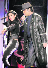 Music maestro A R Rahman performs with one of his lead singers during the Joi Ho- The Journey Home World Tour 2010 concert in Atlantic City, USA.