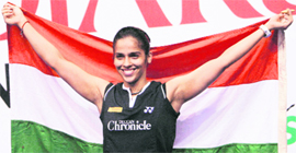 Saina Nehwal holds the Tricolour after winning the womens singles final at the Indonesia Open Badminton Super Series in Jakarta on Sunday.