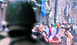 Protesters clash with the police in Srinagar on Thursday.