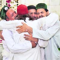 LOCKED IN GRIEF: Devotees mourn at the Data Durbar shrine in Lahore