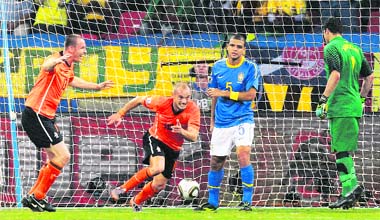 The NetherlandsWesley Sneijder (second from left) celebrates after scoring the winning goal during the World Cup quarterfinal match against Brazil in Port Elizabeth