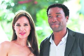 Actors Angelina Jolie (L) and Chiwetel Ejiofor pose during the launch of their movie Salt in Cancun.