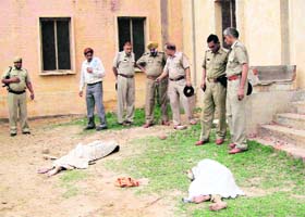 The bodies of Reena and Gogi at the school ground in Samain village in Fatehabad district on Sunday