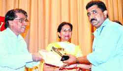 Dr T Ramasami (left), secretary, Dept of Science and Technology, honours an awardee at the PGI Foundation Day in Chandigarh on Wednesday.