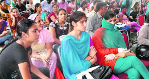 Students seeking admission to BCom await their turn at the gymanisum hall in Panjab University, Chandigarh, on Wednesday.