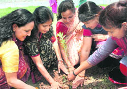 Members of the Air Force Wives Welfare Association take part in a plantation drive at 12 Wing in Chandigarh on Wednesday.