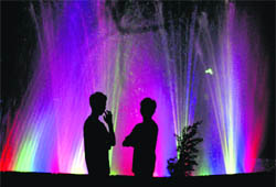People enjoy near the musical fountain at Sector 30 in Chandigarh on Wednesday.