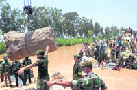 Armymen struggle to plug breach in SYL canal near Jyotisar in Kurukshetra