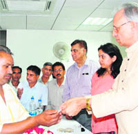 Haryana Food and Supplies Minister Mahender Partap Singh distributes smart cards to beneficiaries after the launch of smart card-based Targeted Public Distribution System Project in Panchkula.