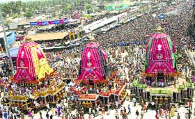 FAITH ON THE MOVE: Devotees flock around the chariots of Lord Jagannath, Balabhadra and Subhadra before the start of the Rath Yatra in Puri