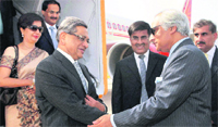 On peace mission: External Affairs Minister SM Krishna being received by the Pakistan High Commissioner to India, Shahid Malik (R), in Islamabad