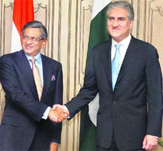 External Affairs Minister SM Krishna shakes hands with his Pakistani counterpart Shah Mehmud Qureshi at a meeting in Islamabad on Thursday. 