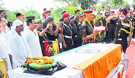 Lieut-Gen Jasbir Singh pays homage to martyr of 1962 Indo-China war Karam Chand at Agojar village, near Palampur, on Thursday.