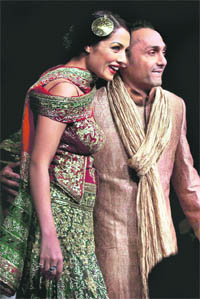Rahul Bose and Celina Jaitely walk the ramp during a fashion show in Bangalore on Saturday night.