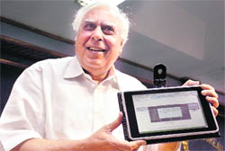 Kapil Sibal unveiling the Rs 1,500 computer for students in New Delhi on Thursday