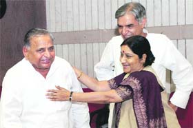 WILL THE SMILES LAST? Leader of Opposition Sushma Swaraj with SP chief Mulayam Singh Yadav (L) and Parliamentary Affairs Minister Pawan Kumar Bansal at an all-party meeting in New Delhi