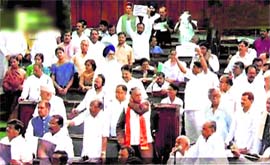 Opposition MPs disrupt proceedings in the Lok Sabha in New Delhi on Tuesday.