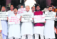 BJP MPs hold placards dema