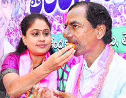 TRS chief Chandrashekhar Rao being offered sweets by party MP Vijayashanthi in Hyderabad on Friday.