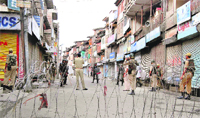 CRPF men guard a street in Srinagar 