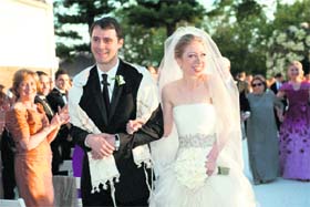MAN & WIFE: Chelsea Clinton and her husband Marc Mezvinsky during their gala wedding at Hudson river estate in Rhineback
