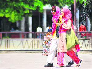 Two women walk the talk in Sector 17 plaza.