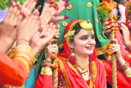 A girl in a joyous mood during Teej celebrations at Khalsa College for Women in Ludhiana.