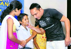 Actor Rahul Bose interacts with under-privileged children during announcement of 'World's Largest Design for Change School-2010' contest in Kolkata on Thursday
