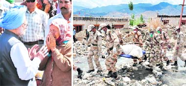 Prime Minister Manmohan Singh comforts Tesring Dolma, a flood victim, who broke down while talking to him, at Choglamsar village in Leh on Tuesday; (right) ITBP men exhume a body from the rubble