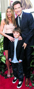 Cast members Jennifer Aniston (L), Jason Bateman (R) and Thomas Robinson pose at the premiere of The Switch at the Arclight theatre in Hollywood, California recently