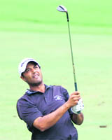 Arjun Atwal hits his second shot on the first hole during the final round of the Wyndham Championship in Greensboro.