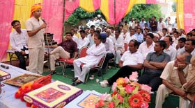 Jitender Kumar Soni, IAS, speaking at the Sneh Milan function in Dhannasar village