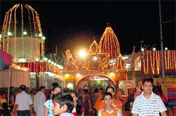 A temple bedecked with lighting on the eve of Janamashtmi in Sector 20, Chandigarh, on Wednesda