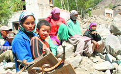Leh cloudburst survivors wait for relief amid the debris of their homes.