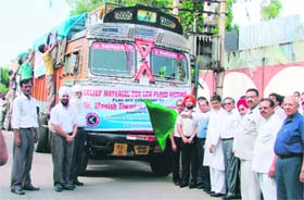 Manish Tewari, local MP, flags off two truck loads of relief material meant for residents of Leh in Ludhiana
