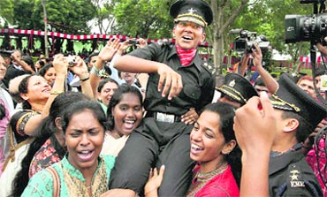 Divya Ajith Kumar celebrates with her friends after receiving the coveted Sword of Honour at the Passing Out Parade of the Officers' Training Academy in Chennai on Saturday.