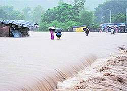 Flooded slum colonies reflect the fury of water.