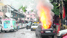 A car which burst into flames near the site where foreign tourists were attacked outside the Gate No. 3 of Jama Masjid in Delhi on Sunday.